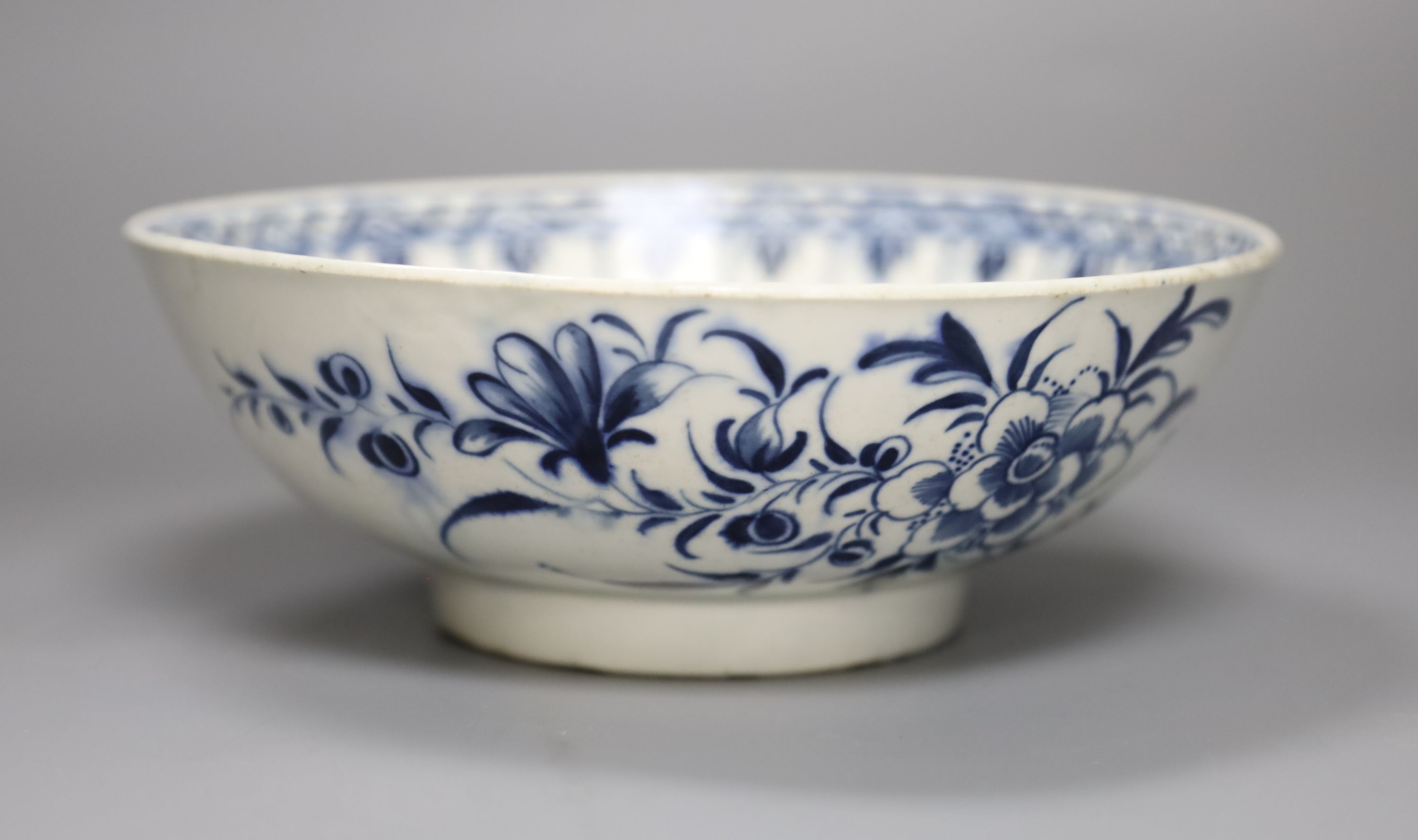 An 18th century Worcester bowl painted with the Peony pattern in blue, Workmans mark in blue to base, diameter 19cm